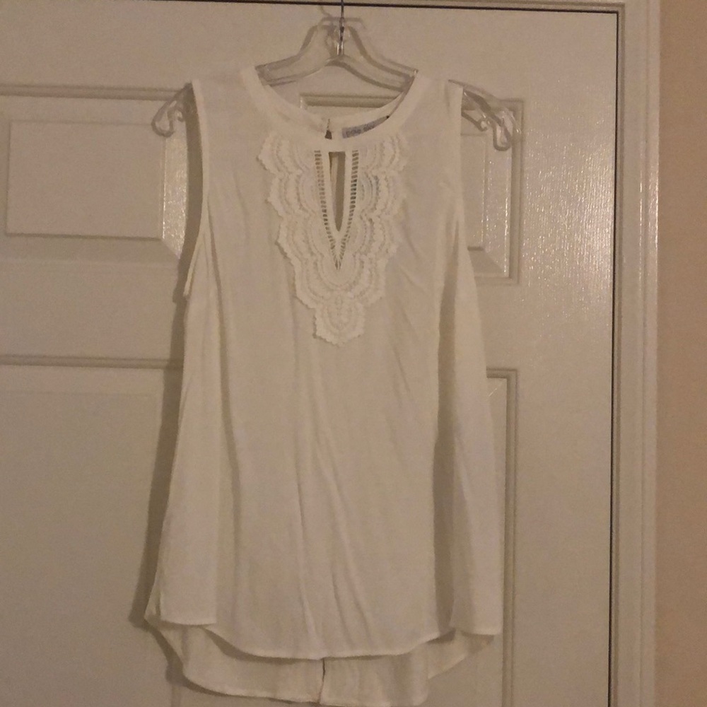 New sleeveless white blouse